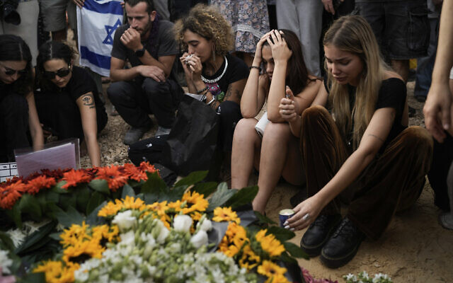 Mourners attend the funeral of Shani Louk in Srigim, on May 19, 2024, two days after her body was recovered from Gaza by the IDF. (AP Photo/Leo Correa)