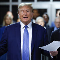 Former US President Donald Trump speaks to members of the media before entering the courtroom with his attorney Todd Blanche at Manhattan Criminal Court on May 20, 2024 in New York. (Michael M. Santiago/Pool Photo via AP)