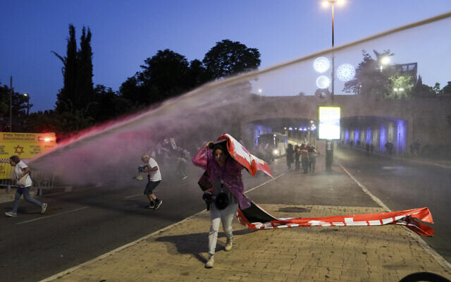 Police use putrid Skunk liquid to disperse demonstrators blocking a road during a protest against Prime Minister Benjamin Netanyahu's government in Jerusalem on May 20, 2024. (AP Photo/Mahmoud Illean)