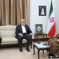 Supreme Leader Ayatollah Ali Khamenei, right, speaks with Hamas chief Ismail Haniyeh, center, as Iran's acting President Mohammad Mokhber sits at left, during their meeting in Tehran, Iran, May 22, 2024. (Official website of the Office of the Iranian Supreme Leader via AP)