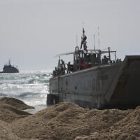 A US Army landing craft is seen beached in Ashdod on Sunday, May 26, 2024, after being swept by wind and current from the temporary humanitarian pier in the Gaza Strip. (AP Photo/Tsafrir Abayov)