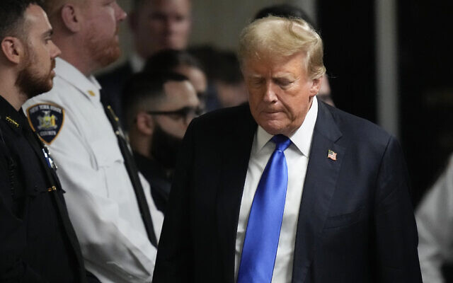 Former US president Donald Trump walks to make comments to members of the media after a jury convicted him of felony crimes for falsifying business records in a scheme to illegally influence the 2016 election, at Manhattan Criminal Court, Thursday, May 30, 2024, in New York. (AP Photo/Seth Wenig, Pool)