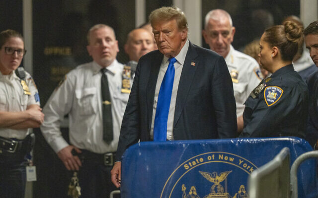 Former president Donald Trump walks outside of a Manhattan courtroom after a jury convicted him of felony crimes for falsifying business records in a scheme to illegally influence the 2016 election Thursday, May 30, 2024, in New York. (Steven Hirsch/New York Post via AP, Pool)