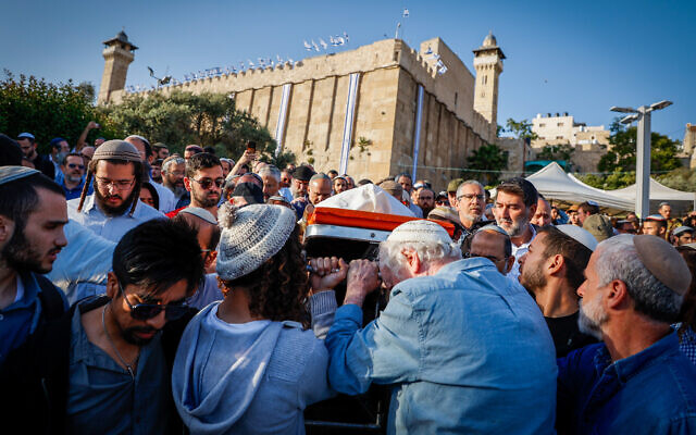 Family and friends of Elyakim Libman attend his funeral outside the Tomb of the Patriarchs, in the West Bank city of Hebron, May 5, 2024. (Gershon Elinson/ Flash90)