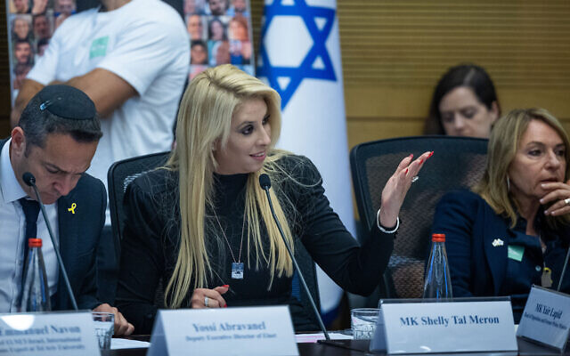 MK Shelly Tal Meron (center) addresses the 'Global Women’s Coalition Against Gender Based Violence as a Weapon of War' at the Knesset, May 20, 2024. (Yonatan Sindel/ Flash90)