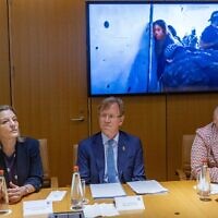 Spanish Ambassador Ana Sálomon Pérez (L), Norwegian Ambassador Per Egil Selvaag (C) and Irish Ambassador Sonya McGuinness watch footage of female soldiers being abducted from the Nahal Oz base on October 7 at the Foreign Ministry in Jerusalem, May 23, 2024. (Yonatan Sindel/Flash90)