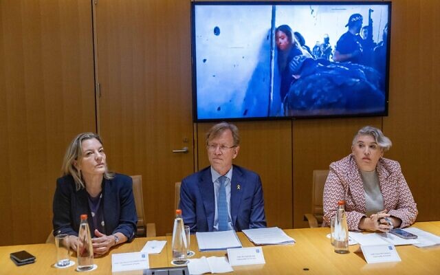 Spanish Ambassador Ana Sálomon Pérez (L), Norwegian Ambassador Per Egil Selvaag (C) and Irish Ambassador Sonya McGuinness watch footage of female soldiers being abducted from the Nahal Oz base on October 7 at the Foreign Ministry in Jerusalem, May 23, 2024. (Yonatan Sindel/Flash90)