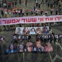 Demonstrators hold images of five female soldiers held hostage by Hamas terrorists in Gaza, calling to 'save those who still can be' as they protest calling for the release of all hostages held in the Gaza Strip outside the Defense Ministry in Tel Aviv, May 25, 2024. (Erik Marmor/Flash90)