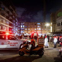 Police and rescue forces at the scene where 11-year-old Lee-Yam Nahum was killed after a fire broke out in a residential building in Ashdod, May 25, 2024. (Liron Moldovan/Flash90)