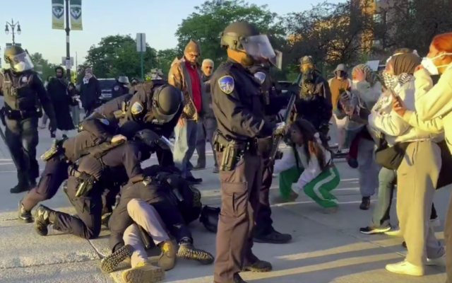 Police detain a protester at an anti-Israel encampment at Wayne State University in Detroit, May 30, 2024. (Screenshot: X, used in accordance with Clause 27a of the Copyright Law)