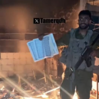 An IDF soldier seen throwing a Quran into a fire in Gaza. (X screengrab)