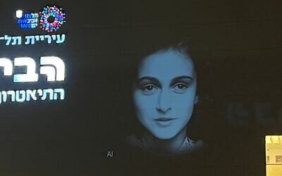 The illuminated image of Anne Frank's face projected on the walls of Tel Aviv's Habima Theater on May 1, 2024, ahead of Holocaust Remembrance Day (Courtesy)
