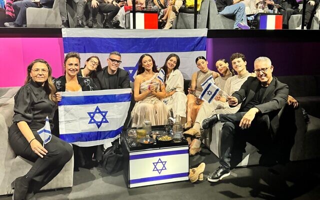 Eden Golan (center) and the Israeli delegation in the green room after her performance at the second Eurovision semifinal in Malmo, Sweden, on May 9, 2024. (Courtesy Kan)