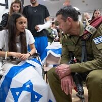 Wounded IDF paramedic Gaya Zubery (left) speaks with IDF Chief of Staff Lt. Gen. Herzi Halevi as he visits wounded soldiers at Sheba Medical Center. (IDF)