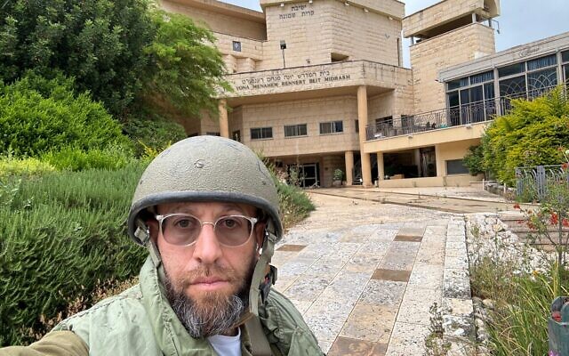 At 43 years old, Rabbi Avi Poupko joined the IDF following the October 7 massacres and serves in the north in a reserves unit. Pictured here in Kiryat Shemona, May 2024. (courtesy)