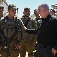 Prime Minister Benjamin Netanyahu with IDF soldiers in southern Israel, May 16, 2024 (Maayan Toaf / GPO)