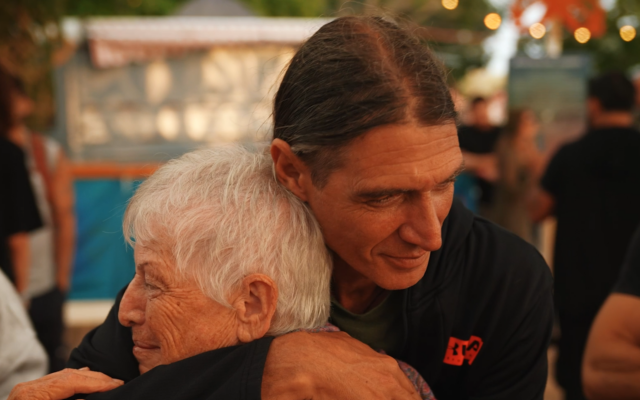 Sara Jackson hugs a survivor of the Nova party in Tel Aviv on May 2, 2024. (Nova Tribe Foundation)