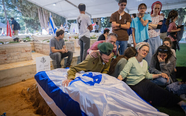 Family and friends of Captain Roy Beit Yaakov attend his funeral at the Mount Herzl Military Cemetery in Jerusalem on May 16, 2024. (Photo by Chaim Goldberg/Flash90)