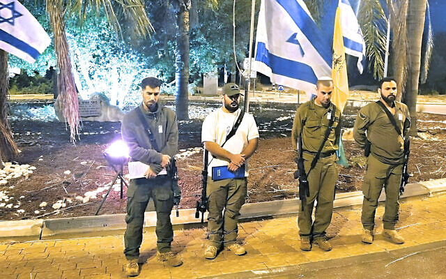 Members of the security team of Shomera hold a memorial ceremony for fallen soldiers on May 12, 2024. (Courtesy of Shimon Vaknin)