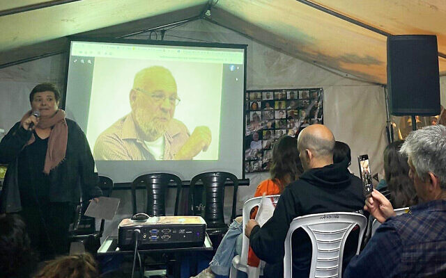 Tamar Pearlman, left, niece of Hamas hostage Alex Dancyg, speaks about her uncle's Holocaust history at a Zikaron Basalon event in Jerusalem on Holocaust Remembrance Day, May 5, 2024. (Jessica Steinberg/Times of Israel)