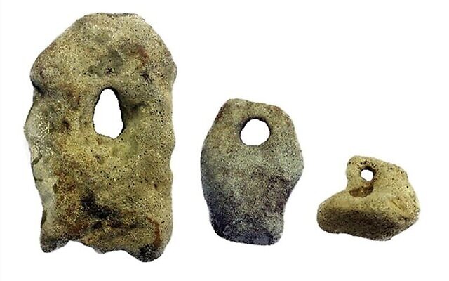 Stone sinkers likely used to weigh down fishing nets, found at the 'Habonim North' martime archaeological site, off the coast of northern Israel. (courtesy Cambridge University Press/CC BY)
