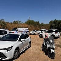 Police, ambulance and rescue vehicles at the scene where a body was found near the Morasha cemetery in Ramat Sharon in central Israel, May 16, 2024. (ZAKA)