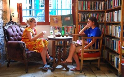 Book lovers unite at Jerusalem's Tmol Shilshom cafe, celebrating 30 years in June 2024 (Courtesy)