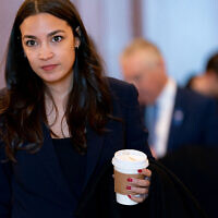 US Representative Alexandria Ocasio-Cortez (D-NY) departs after viewing graphic footage from the October 7, 2023, Hamas massacre in Israel, shown by the US House Foreign Affairs Committee, on Capitol Hill in Washington, DC, on November 14, 2023. (Stefani Reynolds/AFP)