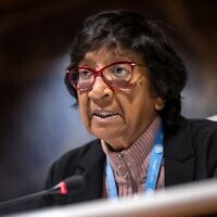 Chairwoman of the 'The United Nations Independent International Commission of Inquiry on the Occupied Palestinian Territory, including East Jerusalem, and in Israel,'  South-Africa's Navi Pillay (R) speaks during a briefing to UN member states about ongoing investigations of the Commission at the UN offices in Geneva, on April 16, 2024. (Photo by Fabrice COFFRINI / AFP)
