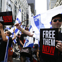 People march on Fifth Avenue to demand the release of the hostages held by Hamas in Gaza as they participate in the annual Israel Day Parade on June 2, 2024 in New York City. (John Lamparski / AFP)