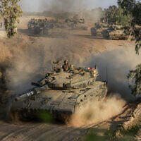An Israeli tank drives in an area of Israel's southern border with the Gaza Strip on June 4, 2024. (Menahem Kahana/AFP)