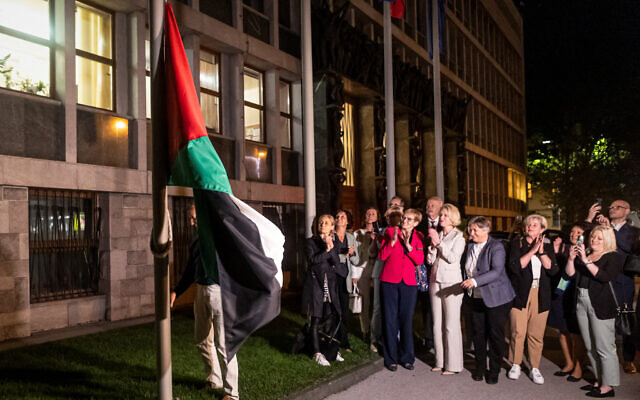 People hang a Palestinian flag in front of the Slovenian Parliament building after the National Assembly recognized a Palestinian state in Ljubljana, on June 4, 2024. (Photo by AFP)