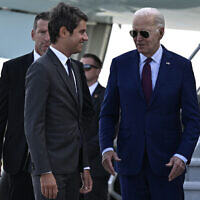 US President Joe Biden (R) is welcomed by France's Prime Minister Gabriel Attal (front L) upon arrival at Paris Orly airport near Paris, on June 5, 2024, as he travels to commemorate the 80th anniversary of D-Day. (Julien De Rosa/Pool/AFP)