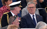 Britain's main opposition Labour Party leader Keir Starmer (R) attends the UK Ministry of Defense and the Royal British Legions commemorative ceremony marking the 80th anniversary of the World War II "D-Day" Allied landings in Normandy, at the British Normandy Memorial near the village of Ver-sur-Mer which overlooks Gold Beach and Juno Beach in northwestern France, on June 6, 2024. (Gareth Fuller / POOL / AFP)