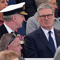 Britain's main opposition Labour Party leader Keir Starmer (R) attends the UK Ministry of Defense and the Royal British Legions commemorative ceremony marking the 80th anniversary of the World War II "D-Day" Allied landings in Normandy, at the British Normandy Memorial near the village of Ver-sur-Mer which overlooks Gold Beach and Juno Beach in northwestern France, on June 6, 2024. (Gareth Fuller / POOL / AFP)