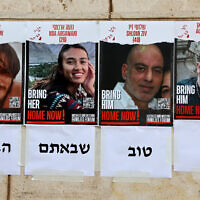 Posters depicting the portraits of rescued Israeli hostages Andrey Kozlov, 27, Noa Argamani, 26, Shlomi Ziv, 41, and Almog Meir Jan, 22, are plastered on a wall in Tel Aviv on June 8, 2024. The text underneath reads 'it's so good you came home.' (Gil Cohen-Magen/AFP)