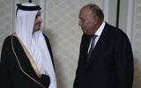 Egyptian Foreign Minister Sameh Shoukry, right, talks to Qatari Prime Minister Sheikh Mohammed bin Abdulrahman bin Jassim Al Thani, before their meeting with US Secretary of State Antony Blinken (not in picture), in Cairo, Egypt, March 21, 2024. (AP/Amr Nabil)
