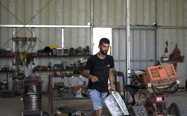 Yinon Levi works on his farm in the South Hebron Hills, West Bank, May 12, 2024. (Maya Alleruzzo/AP)