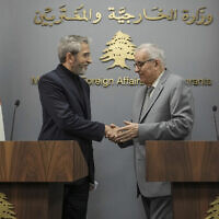 Iranian interim Foreign Minister Ali Bagheri Kani, left, shakes hands with Lebanese Foreign Minister Abdallah Bouhabib, after their news conference in Beirut, Lebanon, Monday, June 3, 2024. Kani arrived in Lebanon Monday, his first official diplomatic visit since his predecessor died in a helicopter crash last month. (AP Photo/Hassan Ammar)