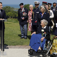 French President Emmanuel Macron addresses British D-Day veterans during a commemorative ceremony marking the 80th anniversary of the World War II Allied landings in Normandy, at the World War II British Normandy Memorial of Ver-sur-Mer, Thursday, June 6, 2024. (Ludovic Marin/Pool via AP)