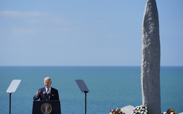 US President Joe Biden delivers a speech on the legacy of Pointe du Hoc, and democracy around the world, Friday, June 7, 2024 as he stands next to the Pointe du Hoc monument in Normandy, France. (AP Photo/Evan Vucci)