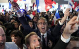 Supporters of the French far-right National Rally party react at the party's election night headquarters in Paris on June 9, 2024. (AP Photo/Lewis Joly)