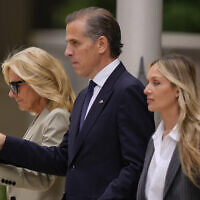 Hunter Biden, center, accompanied by his mother, US First Lady Jill Biden, left, and his wife, Melissa Cohen Biden, right, walking out of federal court after hearing the verdict, June 11, 2024, in Wilmington, Delaware. (AP Photo/Matt Rourke)