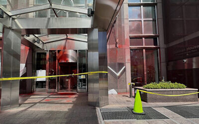 Red paint covers portions of the entrance to the German consulate building, June 12, 2024, in New York. (AP Photo/Sophie Rosenbaum)
