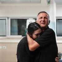 Noa Argamani is embraced by her father, Yaakov, at Sheba Medical Center after being rescued from Hamas captivity, June 8, 2024. (IDF Spokesperson's Unit)
