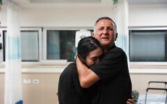 Noa Argamani is embraced by her father, Yaakov, at Sheba Medical Center after being rescued from Hamas captivity, June 8, 2024. (IDF Spokesperson's Unit)