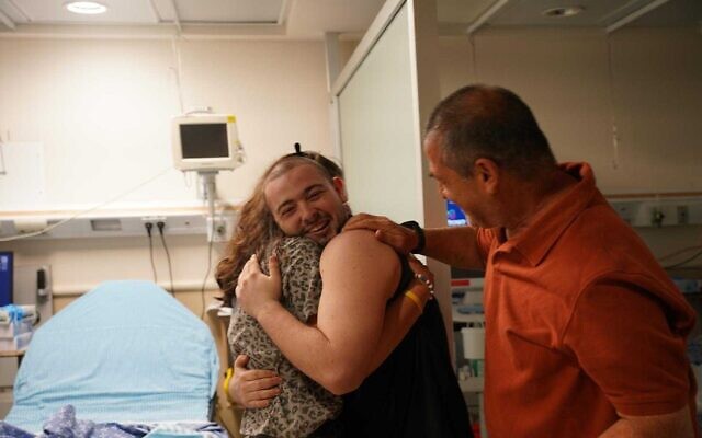 Almog Meir Jan reunites with his parents at Sheba Medical Center after being rescued from Hamas captivity alongside Noa Argamani, Shlomi Ziv, and Andrey Kozlov, June 8, 2024. (IDF Spokesperson's Unit)