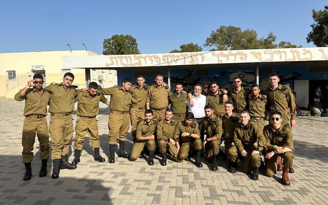 In this undated photo, Rabbi Shimon Hartman, center in white shirt, with Haredi soldiers from Chedvata Yeshiva. (Courtesy)