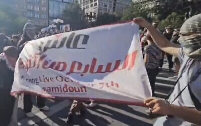 Anti-Israel protesters unfurl a banner that reads, "Long live October 7" outside an exhibit in New York City memorializing the Nova festival massacre, on June 10, 2024. (Screen capture/X)