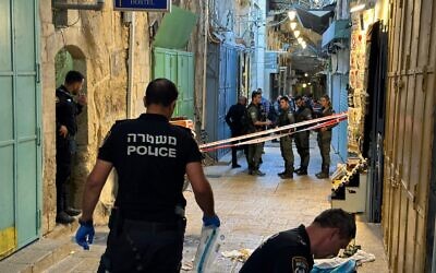 Police gather evidence at the scene where an off-duty soldier shot a man in Jerusalem's Old City, June 12, 2024. (Israel Police)